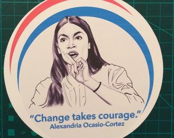May include: A white circular sticker with a red and blue border. The sticker features a black and white line drawing of a woman with long dark hair. The woman is looking to the right and has her hand on her chin. The text "Change takes courage." and "Alexandria Ocasio-Cortez" is printed below the image.