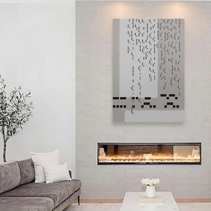 May include: A modern abstract painting in shades of gray with black geometric shapes. The painting is hanging above a fireplace with a lit fire.