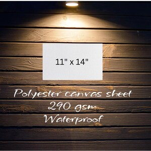 May include: A white canvas sheet with the text "11" x 14" printed on it. The sheet is on a dark wood background. The text "Polyester canvas sheet 290 gsm Waterproof" is printed below the sheet.