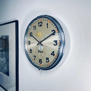 Vintage Burk Industrial Chrome Wall Clock – Sleek, Modern Timepiece for Contemporary Spaces