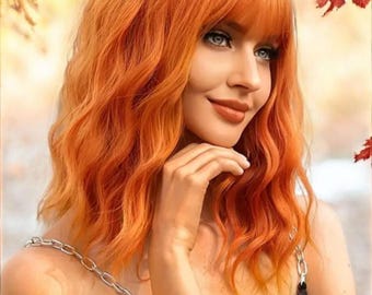 Short orange wavy synthetic wig with bangs