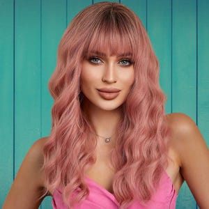 Long wavy pink synthetic wig with bangs