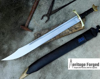 May include: A handmade sword with a polished steel blade, brass accents, and a black handle. The sword rests on a wooden plank with a black sheath. The image includes the text "Aeritage Forged".