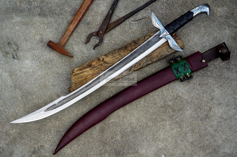 May include: A handcrafted sword with a silver blade and black handle, resting on a wooden plank. The sword is accompanied by a burgundy leather sheath with green accents. Blacksmith tools, including a hammer and tongs, are visible.