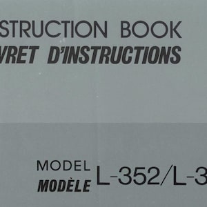 May include: A gray instruction book with the title "INSTRUCTION BOOK" and "LIVRET D'INSTRUCTIONS" in black text. Below, the text "MODEL" and "MODELE" is followed by "L-352/L-353".