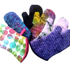 May include: A set of eight colorful oven mitts with different patterns, including polka dots, tie-dye, and geometric designs.