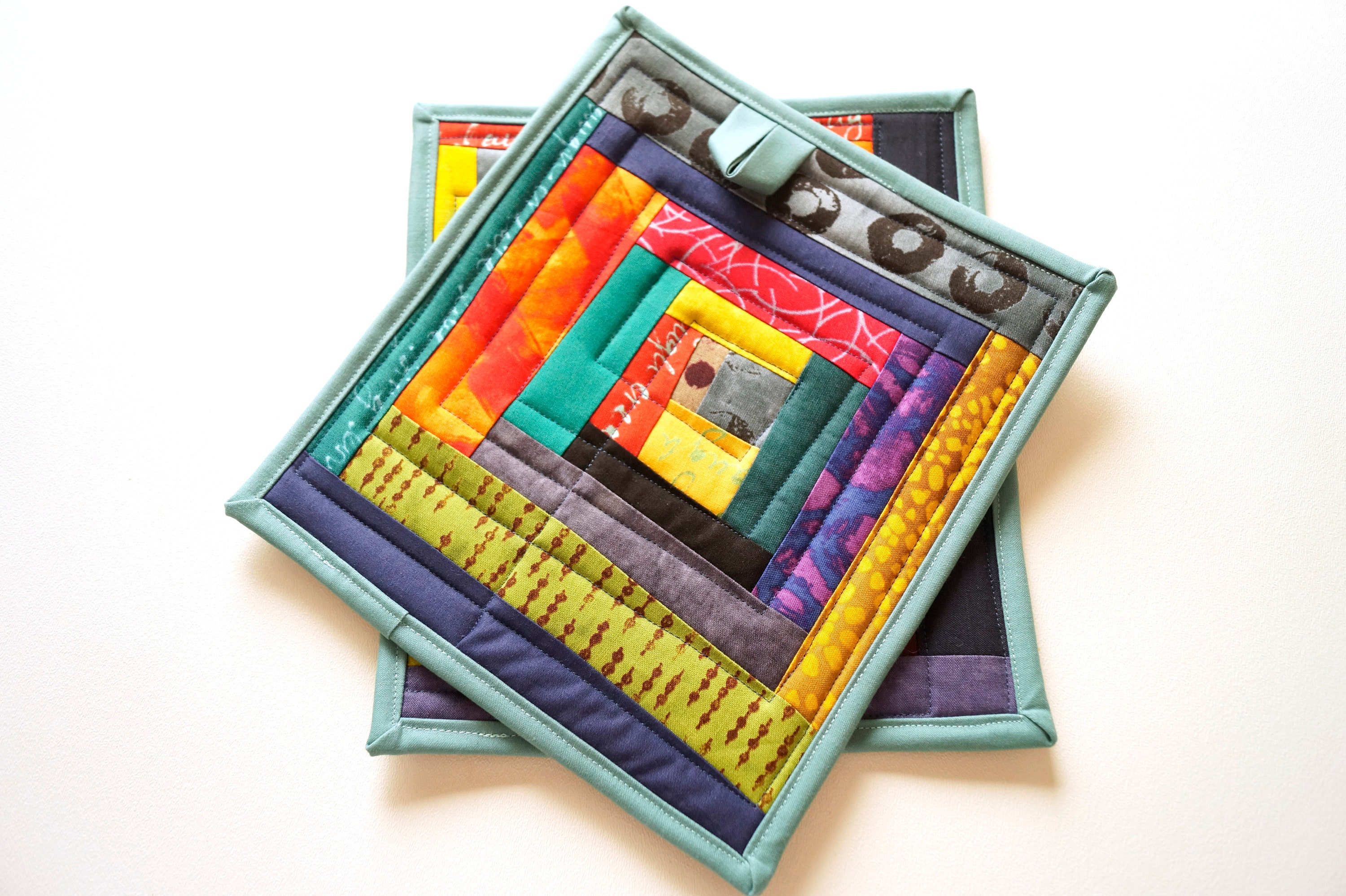 Download Quilted Fabric Pot Holders with Colorful Abstract ...