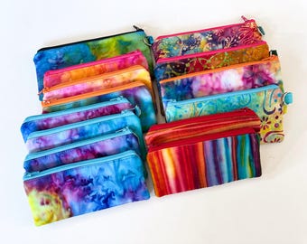 Bolsas acolchadas con cremallera y telas batik de algodón de colores