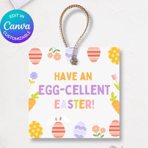 May include: White printable Easter tag with a string for hanging. The tag has a colorful design with eggs, flowers, and carrots. The text on the tag reads "Have an Egg-cellent Easter!"