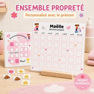 Peut inclure: Un ensemble de tableaux de propreté avec deux panneaux blancs aux accents roses, portant les textes ENSEMBLE PROPRETÉ, Maëlle devient propre et Sur la route de la propreté, avec des jetons carrés illustrés de fleurs, crottes et gouttes.