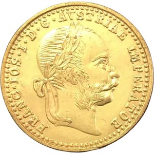 Puede incluir: Moneda de oro con el perfil de un hombre con bigote y corona de laurel. El borde de la moneda tiene un diseño de cuentas y el texto está inscrito alrededor del perímetro. La moneda tiene una superficie brillante y reflectante.
