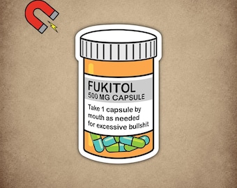 May include: A sticker featuring a cartoon pill bottle labeled "FUKITOL 500 MG CAPSULE." The label instructs to take one capsule as needed for excessive bullshit. The bottle contains blue and green capsules. A magnet is in the upper left corner.