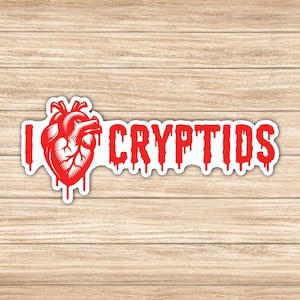 Pegatina &quot;Amo a los Críptidos&quot; para portátiles, tabletas, botellas de agua, espejos y más. Disponible en diferentes tamaños.