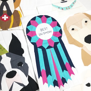 May include: A blue, pink, and white fabric rosette with the text "BEST IN SHOW" in the center. The rosette is surrounded by various dog breeds made of fabric.