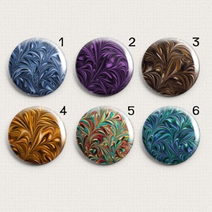 May include: Six round buttons with different marbled patterns. The buttons are numbered 1 through 6. The patterns are in shades of blue, purple, brown, gold, red, and green.