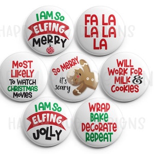 May include: A collection of seven white round buttons with Christmas-themed text and graphics. The buttons feature phrases like "I am so elfing merry," "Fa la la la," and "Will work for milk & cookies" in red, green, and black.
