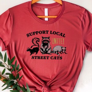 Support Local Street Cats T-Shirt - Funny Raccoon, Skunk, and Opossum Graphic Tee, Animal Lovers Gift, Urban Wildlife Shirt&quot;