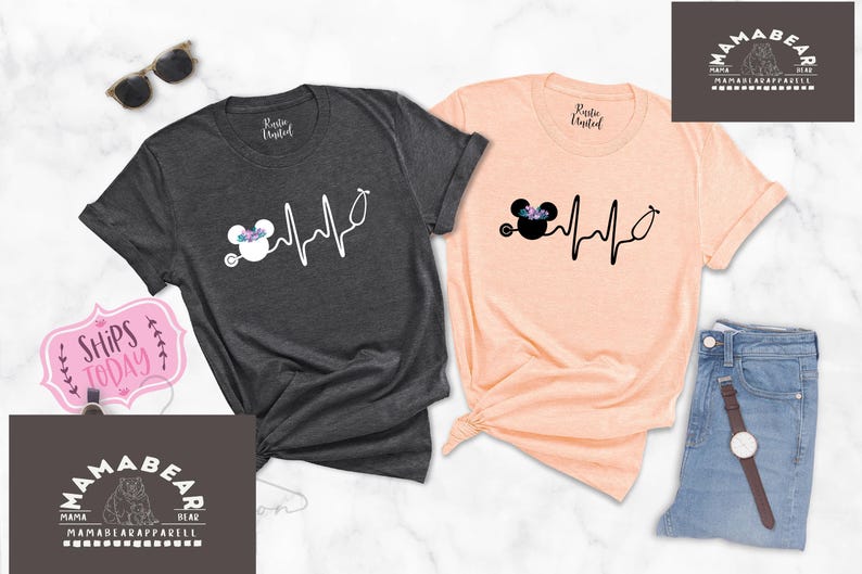 May include: Two t-shirts featuring a black and white graphic of a cartoon mouse wearing a flower crown and a stethoscope with a heartbeat line. The text "Ships Today" is visible in the image.