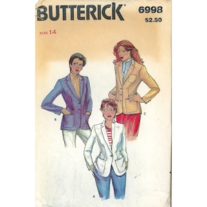 May include: Butterick sewing pattern 6998, size 14, featuring illustrations of three blazer styles. The blazers are shown in blue, tan, and white, each with two front pockets, lapels, and button closures, paired with various shirts and pants.