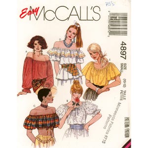 May include: Easy McCall's sewing pattern 4897 for size small (10-12). The envelope features illustrations of five different off-the-shoulder blouse styles, including solid red, white with ruffles, yellow, plaid, and white floral print designs.