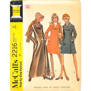 May include: McCall's Patterns 2216 sewing pattern envelope for a misses' coat in three versions. The illustration shows three coat styles: a long brown double-breasted coat, a mid-length orange coat, and a dark grey coat with fur-like trim.