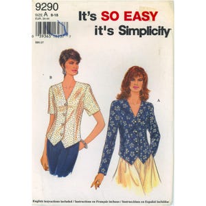 May include: Simplicity sewing pattern featuring two women's tops. One top is a short-sleeved button-up with a polka dot pattern, and the other is a long-sleeved floral print button-up. The pattern size is A 8-18.