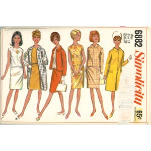 May include: A vintage Simplicity sewing pattern envelope, number 6882, size 14, bust 34. The illustration features six figures wearing various outfits including dresses, skirts, jackets, and coats in yellow, orange, white, and plaid patterns.