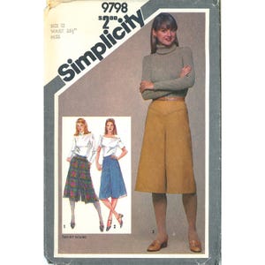 May include: A Simplicity sewing pattern envelope 9798 for size 12 with a 26.5 inch waist. The cover features illustrations and a photograph of culottes in solid tan, plaid, and solid blue, paired with a ribbed turtleneck and white tops.
