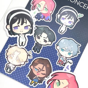 May include: A set of eight colorful cartoon character stickers with white outlines. The stickers feature characters with different hairstyles, clothing, and expressions. The stickers are on a blue background with white polka dots. The text "Alien Concept" is visible at the top of the image.