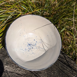 white bowl with cobalt speckles
