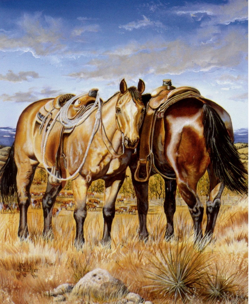 May include: An oil painting depicts two horses in a field, saddled and ready. The horses are a light brown color with dark manes and tails. The background shows a blue sky with clouds and a herd of cattle.