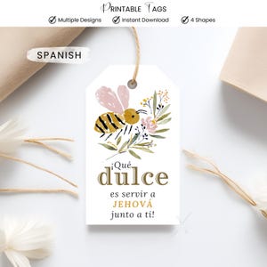 May include: A white tag with a watercolor bee illustration, floral accents, and the Spanish text "¡Qué dulce es servir a JEHOVÁ junto a ti!" The tag has a string for hanging and the words "Printable Tags", "Multiple Designs", "Instant Download", and "4 Shapes".