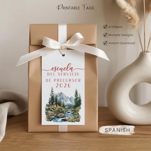 May include: A gift wrapped in brown paper, tied with a white ribbon and tag. The tag reads "escuela DEL SERVICIO DE PRECURSOR 2026" with a watercolor landscape. The words "Printable Tags" are at the top.