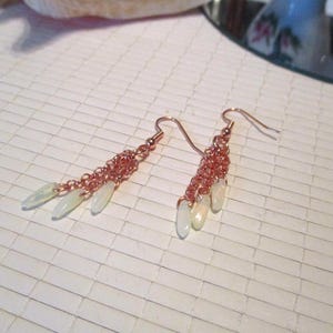 May include: A set of three ceramic mugs with a speckled, matte finish. Each mug features a different color: light blue, cream, and gray. The mugs have a simple, modern design with a rounded shape and a comfortable handle.