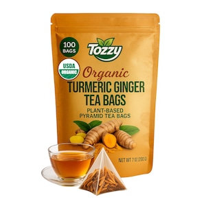 May include: A bag of 100 USDA Organic Turmeric Ginger Tea Bags. The bag is orange and features a green logo with the text "Tozzy" and the words "Plant-Based Pyramid Tea Bags". The bag also features a picture of turmeric root and ginger root.