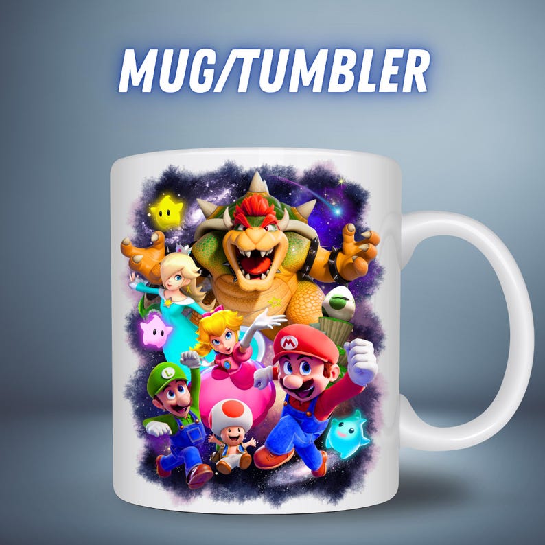 May include: White ceramic mug featuring a colorful graphic of video game characters, including Mario, Luigi, and Bowser, with the text "MUG/TUMBLER" in a blue font. The mug has a white handle and a glossy finish.
