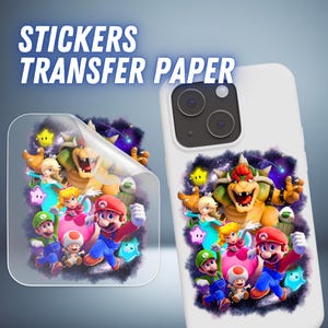 May include: A white phone case and a sticker sheet featuring a colorful illustration of video game characters. The sticker sheet is partially peeled back, revealing the design. The text "STICKERS TRANSFER PAPER" is at the top.