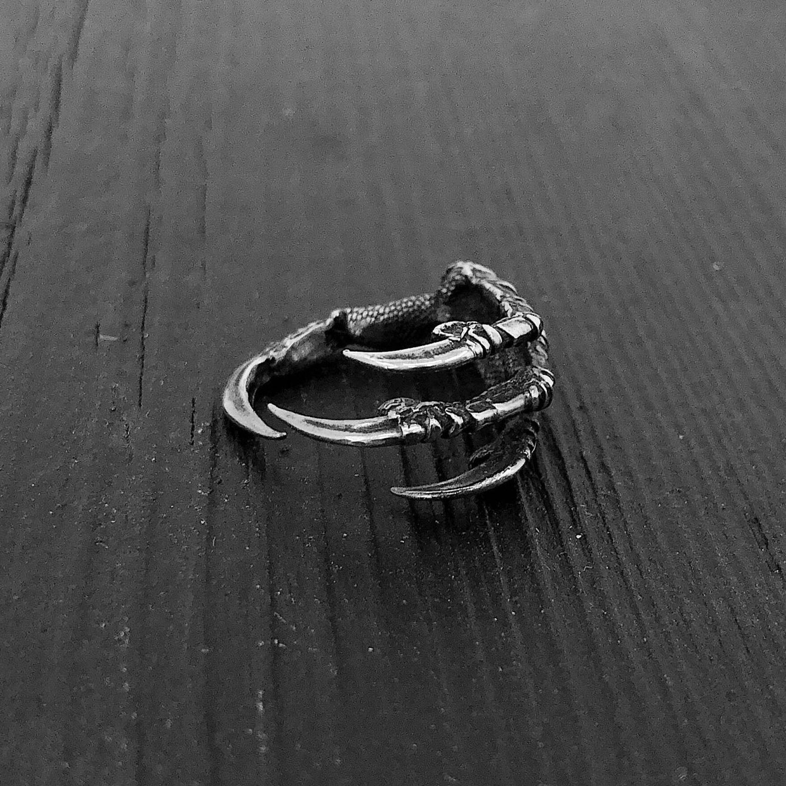 Crow foot ring in oxidized sterling silver with detailed claw wrap design