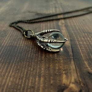 Raven Claw Halskette in Bronze mit Crystal Orb