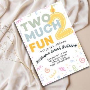 May include: A birthday party invitation with the text "TWO MUCH FUN" in pastel colors. The number "2" is designed as a candle. The invitation includes party details: date, time, location, and RSVP information.