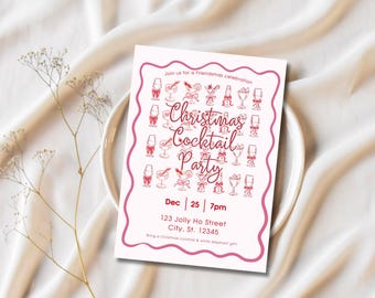 Op de afbeelding: Een roze uitnodiging voor een Christmas Cocktail Party met een decoratieve rand en cocktail illustraties. De uitnodiging bevat de datum, tijd en adres van het evenement. De uitnodiging ligt op een witte plaat en een witte achtergrond.