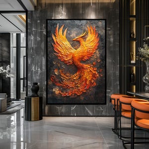 May include: A large framed artwork featuring a phoenix in shades of orange and red against a dark background. The bird is depicted with outstretched wings, showcasing intricate details and textures. The artwork is a decorative piece.