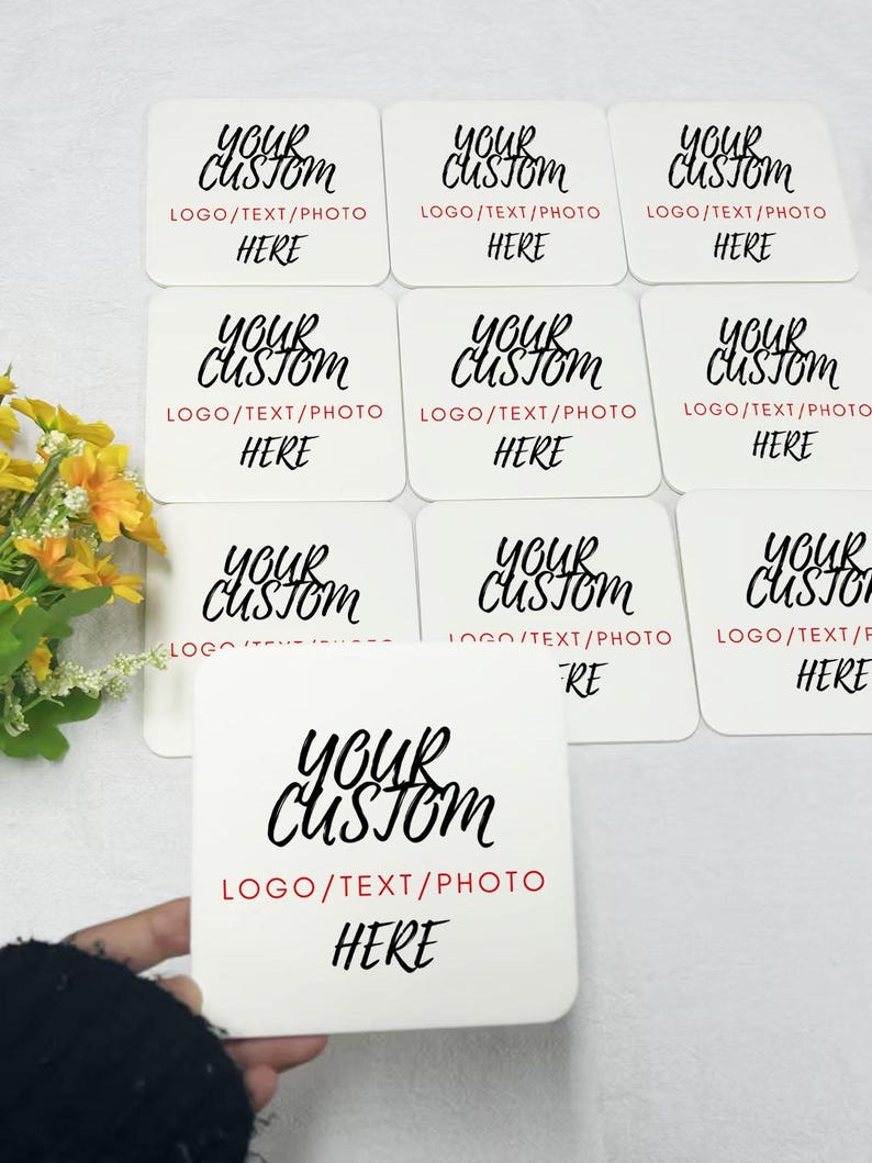 May include: Nine white square coasters with black text that reads "Your Custom" and "Logo/Text/Photo Here".