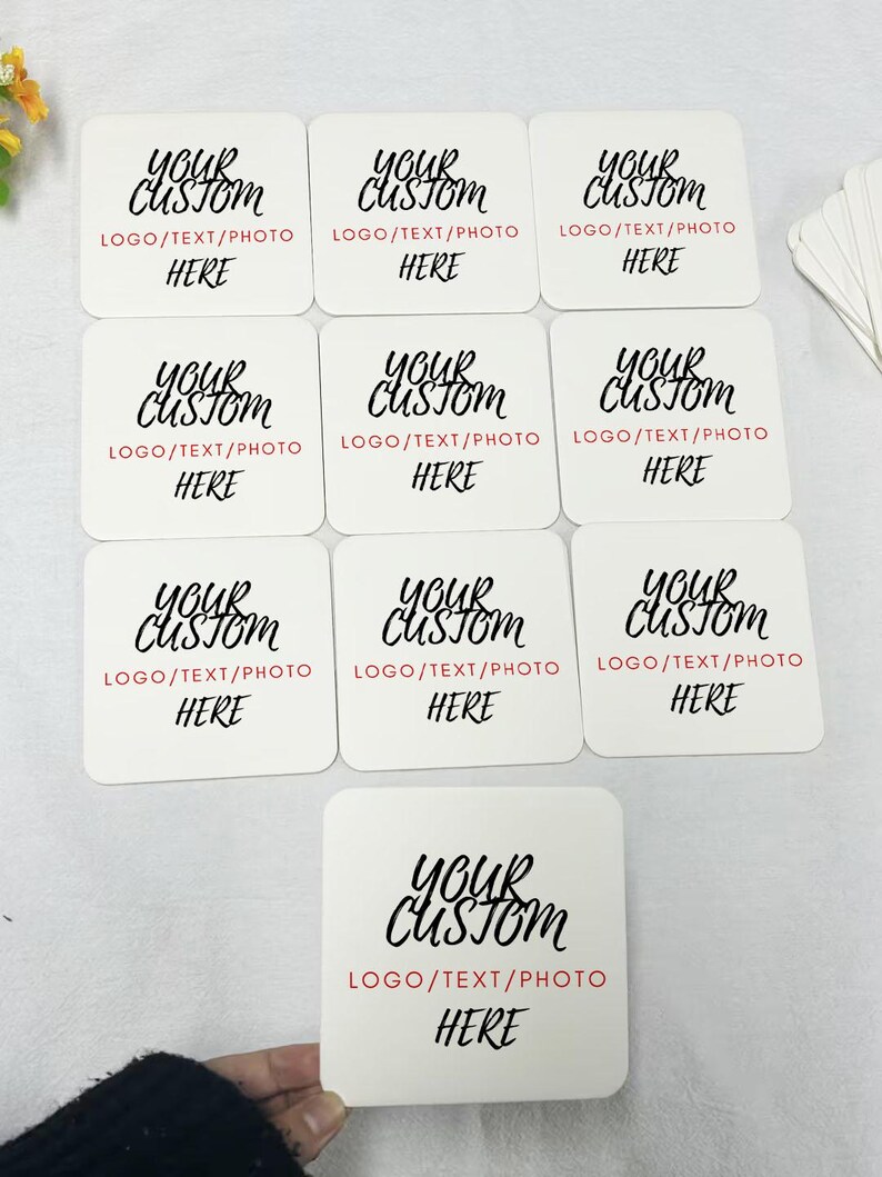 May include: Nine white square coasters with black text that reads "Your Custom" and "LOGO/TEXT/PHOTO HERE".