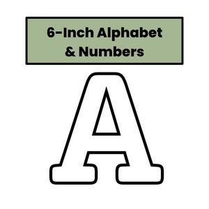 May include: A white letter "A" with a black outline, part of a set of alphabet letters and numbers. The text "6-Inch Alphabet & Numbers" is above the letter in a green rectangle. The letter is approximately 6 inches tall.