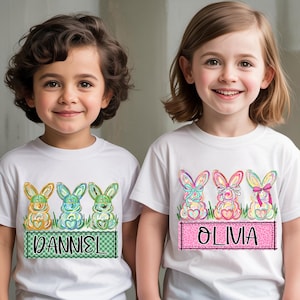 May include: A white ceramic mug with a black handle and the text "But First, Coffee" in a bold, black font. The mug is filled with a dark liquid, likely coffee, and sits on a light-colored surface.