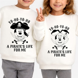 May include: White sweatshirts with a black and white pirate-themed graphic. The design features a cartoon mouse wearing a pirate hat, crossed swords, and the text "YO-HO-YO-HO" and "A PIRATE'S LIFE FOR ME".