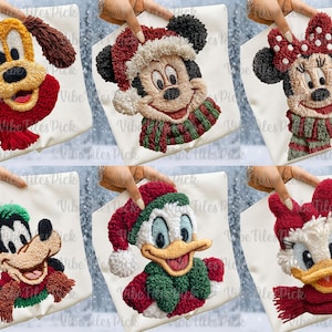 May include: A collection of six white fabric squares, each featuring a different Disney character's face in a festive, textured design. Characters include Pluto, Mickey, Minnie, Goofy, Donald Duck, and Daisy Duck, all wearing winter attire.