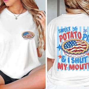 May include: White t-shirt featuring a graphic of a sweet potato pie with an American flag design on the front and back. The back of the shirt has the text "SWEET POTATO PIE & I SHUT MY MOUTH" in blue and red.