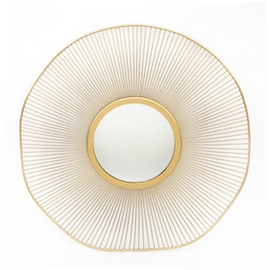 May include: A gold-toned round mirror with a sunburst design. The mirror is framed with a thin gold metal frame and has a circular mirror in the center.